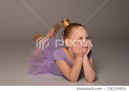 Portrait of young gymnast child with cochlear implant in studio. Hearing loss treatment, cochlear implant rehabilitation, inclusive childhood sport, confidence building, and social integration 136124916