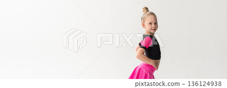 Portrait of child with cochlear implant during dance practice in studio. Banner with copy space. Hearing loss treatment, auditory rehabilitation, assistive medical device, emotional adaptation, and Portrait of child with cochlear implant during dance practice in studio. Banner with copy space. Hearing loss treatment, auditory rehabilitation, assistive medical device, emotional adaptation, and 136124938