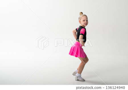 Young dancer with cochlear implant performing expressive sport dance movement. Copy space. Hearing loss rehabilitation, auditory therapy, assistive technology, physical coordination, and confidence 136124940