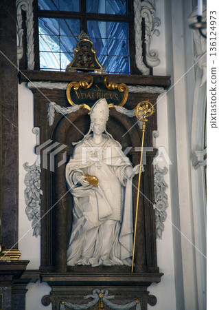 Statue of Saint Ulrich of Augsburg on the altar in Saint Benedict basilica in the famous Benediktbeuern abbey, Germany Statue of Saint Ulrich of Augsburg on the altar in Saint Benedict basilica in the famous Benediktbeuern abbey, Germany 136124973