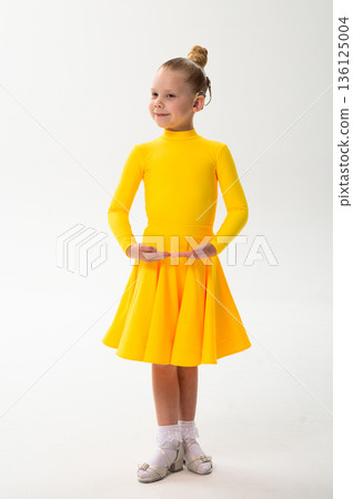 Child with cochlear implant during sport dance practice in studio. Hearing loss treatment, auditory rehabilitation, assistive technology, body coordination, and inclusive physical therapy 136125004