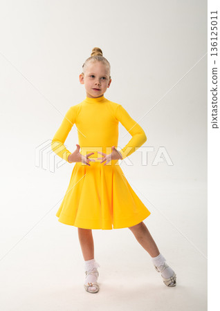 Close-up portrait of child with cochlear implant during dance practice. Hearing loss treatment, auditory rehabilitation, assistive medical technology, emotional adaptation, and inclusive healthcare 136125011