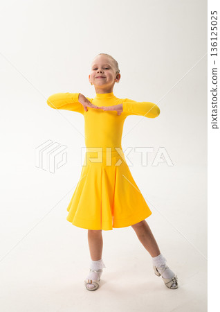 Close-up portrait of child with cochlear implant during dance practice. Hearing loss treatment, auditory rehabilitation, assistive medical technology, emotional adaptation, and inclusive healthcare 136125025