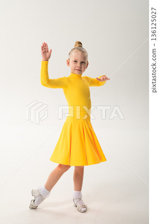 Young dancer with cochlear implant performing expressive movement in studio. Hearing loss rehabilitation, auditory training, assistive medical technology, inclusive sport dance, and physical Young dancer with cochlear implant performing expressive movement in studio. Hearing loss rehabilitation, auditory training, assistive medical technology, inclusive sport dance, and physical 136125027
