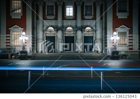 Night cityscape with historic architecture and blue light trails Night cityscape with historic architecture and blue light trails 136125043