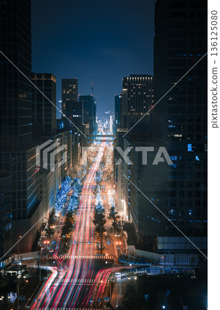Aerial view of the skyscrapers and light trails piercing the metropolis at night Aerial view of the skyscrapers and light trails piercing the metropolis at night 136125080