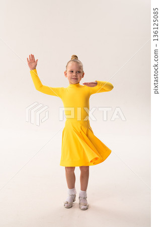 Child with cochlear implant practicing sport dance choreography in studio. Hearing impairment treatment, auditory therapy, rehabilitation process, assistive hearing technology, and inclusive physical Child with cochlear implant practicing sport dance choreography in studio. Hearing impairment treatment, auditory therapy, rehabilitation process, assistive hearing technology, and inclusive physical 136125085