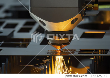 Fiber Laser Cutting Machine Cutting Metal Plate with Sparks in Industrial Manufacturing Scene Fiber Laser Cutting Machine Cutting Metal Plate with Sparks in Industrial Manufacturing Scene 136125162