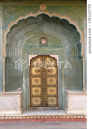 Ornate door at the Chandra Mahal, Jaipur City Palace in Jaipur, Rajasthan, India 136125770