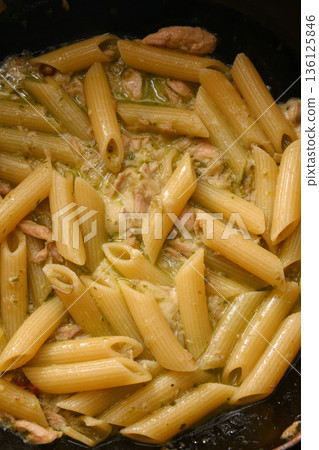 Penne pasta with pesto sauce Penne pasta with pesto sauce 136125846