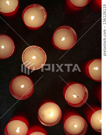 burning wax candles viewed from above burning wax candles viewed from above 136126119