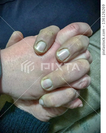 hands of a couple intertwining as a sign of love hands of a couple intertwining as a sign of love 136126269