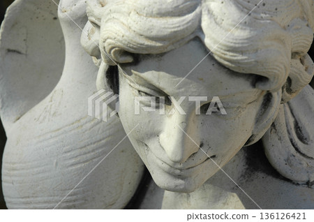 stone sculpture in the shape of a woman stone sculpture in the shape of a woman 136126421