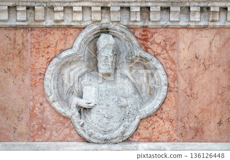 Saint Ambrose by Giovanni di Riguzzo relief on facade of the San Petronio Basilica in Bologna, Italy 136126448