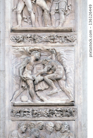 The brothers tinged Joseph's coat with the blood by Giacomo Raibolini, right door of San Petronio Basilica in Bologna, Italy 136126449