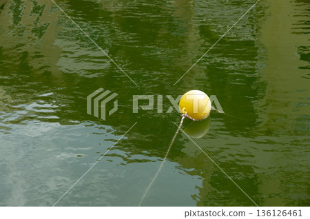 signaling buoy floating on the surface of the harbor channel signaling buoy floating on the surface of the harbor channel 136126461