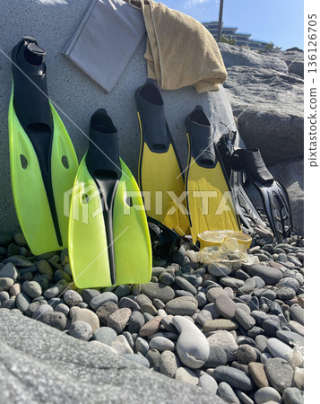 diving  equipment lies on a rock near the beach 136126705