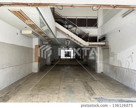 Entrance to an old housing complex, in the ruins 136126873