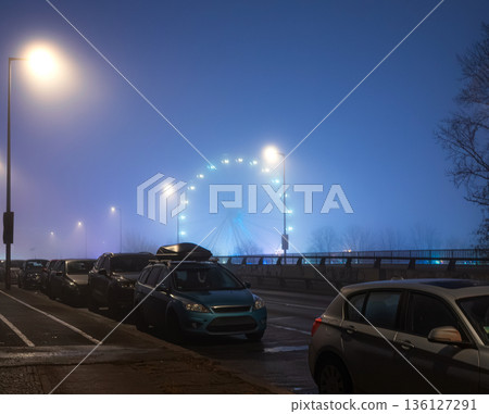 Ferris Wheel at Night in Foggy City Ferris Wheel at Night in Foggy City 136127291
