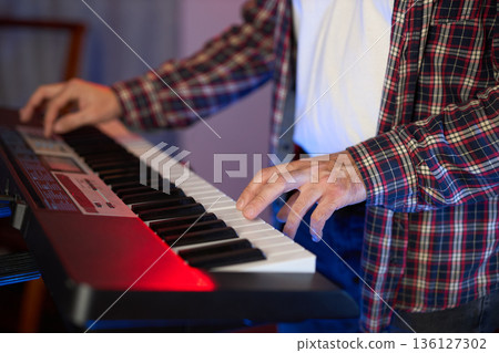 Musician at the Keyboard Musician at the Keyboard 136127302