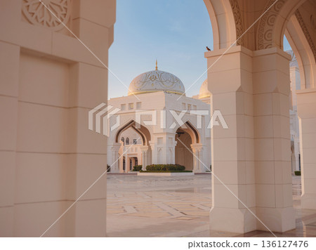 Qasr Al Watan Palace Exterior Architecture Abu Dhabi UAE Description: Magnificent white facade of Qasr Al Watan presidential palace stands under clear blue sky. modern Islamic design in Abu Dhabi. Qasr Al Watan Palace Exterior Architecture Abu Dhabi UAE Description: Magnificent white facade of Qasr Al Watan presidential palace stands under clear blue sky. modern Islamic design in Abu Dhabi. 136127476