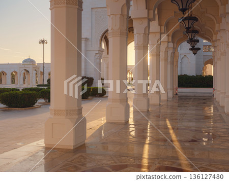 Qasr Al Watan Palace Exterior Architecture Abu Dhabi UAE Description: Magnificent white facade of Qasr Al Watan presidential palace stands under clear blue sky. modern Islamic design in Abu Dhabi. Qasr Al Watan Palace Exterior Architecture Abu Dhabi UAE Description: Magnificent white facade of Qasr Al Watan presidential palace stands under clear blue sky. modern Islamic design in Abu Dhabi. 136127480