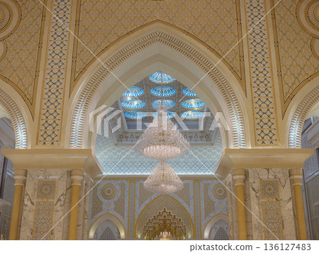 Abu Dhabi, UAE January 15, 2024 Breathtaking interior of Palace features massive golden dome and intricate mosaics. decorations royal opulence inside presidential palace of United Arab Emirates. Abu Dhabi, UAE January 15, 2024 Breathtaking interior of Palace features massive golden dome and intricate mosaics. decorations royal opulence inside presidential palace of United Arab Emirates. 136127483