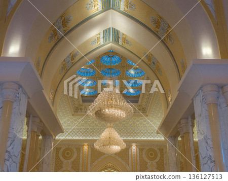 Abu Dhabi, UAE January 15, 2024 Breathtaking interior of Palace features massive golden dome and intricate mosaics. decorations royal opulence inside presidential palace of United Arab Emirates. Abu Dhabi, UAE January 15, 2024 Breathtaking interior of Palace features massive golden dome and intricate mosaics. decorations royal opulence inside presidential palace of United Arab Emirates. 136127513