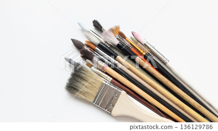 Art brushes isolated on a white background, art supplies set for painting. Calligraphy, squirrel, and synthetic brushes. Art brushes isolated on a white background, art supplies set for painting. Calligraphy, squirrel, and synthetic brushes. 136129786