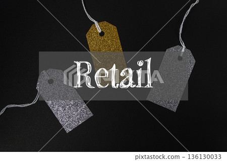 Three tags with gold and silver glitter hanging from a string with the word retai Three tags with gold and silver glitter hanging from a string with the word retai 136130033