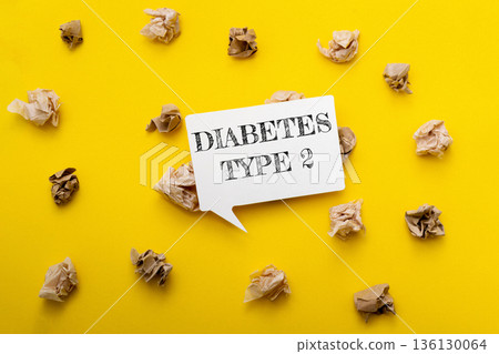 Diabetes type 2 awareness message on a vibrant yellow background with crumpled paper Diabetes type 2 awareness message on a vibrant yellow background with crumpled paper 136130064