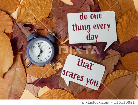 text Do one thing every day that scares you on a beige background 136130081