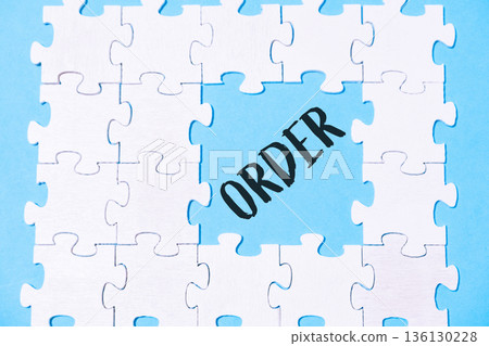 Jigsaw puzzle with the word order written in the middle Jigsaw puzzle with the word order written in the middle 136130228