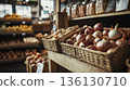 Basket of onions is displayed on a wooden shelf in a grocery store 136130710