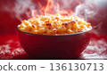 Bowl of macaroni and cheese with a lot of cheese on top 136130713