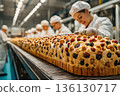 Woman is making a pastry with a bunch of berries on it 136130717