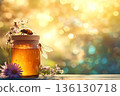 Jar of honey with a bee on top of it 136130718