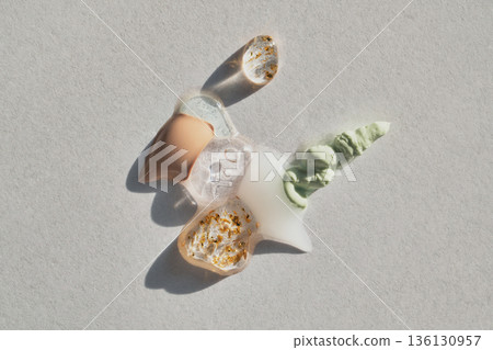 Various textures of skincare and beauty products creating abstract swatches with sparkling gold Various textures of skincare and beauty products creating abstract swatches with sparkling gold 136130957