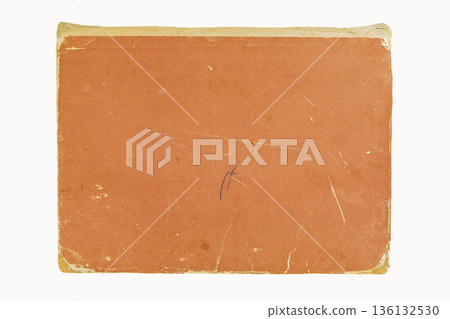 Old orange book cover with worn edges, scratches, and faded texture. Concept of vintage surface used for retro design, paper mockups, nostalgic creative projects 136132530