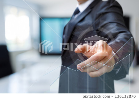Businessman analyzes trends. Businessman analyzes trends. 136132870