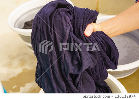 Washing laundry on holidays trip. 136132974