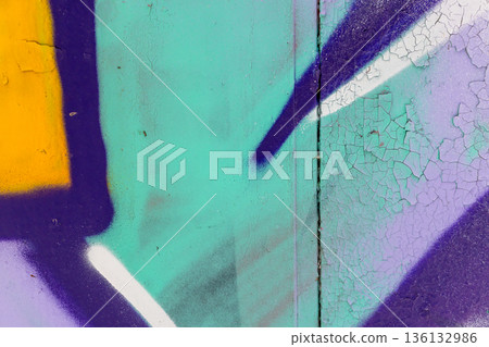 Vibrant graffiti fragment on a weathered wall featuring bold lines Vibrant graffiti fragment on a weathered wall featuring bold lines 136132986