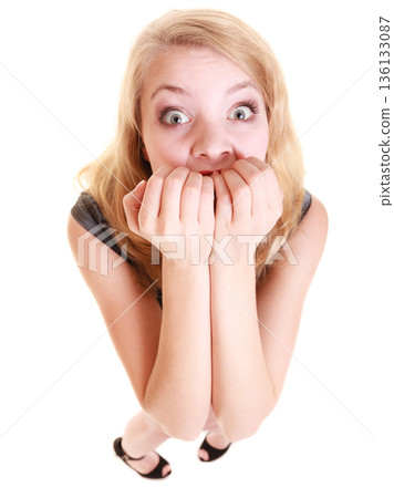 Afraid businesswoman frightened woman. Stress in work. 136133087