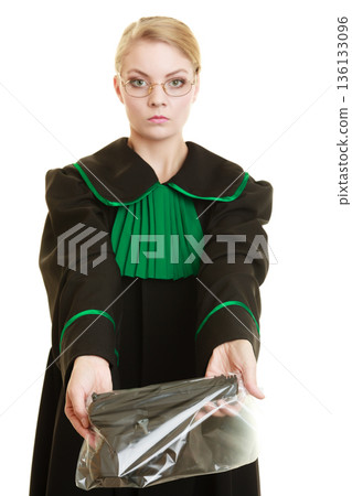 Woman lawyer with gun bag marked evidence for crime. 136133096