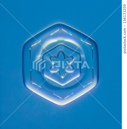 Natural snowflake crystal in blue background Natural snowflake crystal in blue background 136133209