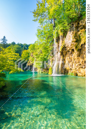 Beautiful waterfalls and lakes at Plitvice national nature park, Croatia. Fresh water stream in peaceful nature. Harmony and meditation, concept of peace and meditation in nature. 136133304