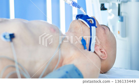 Unconscious patient on life support in hospital intensive care unit Unconscious patient on life support in hospital intensive care unit 136133449
