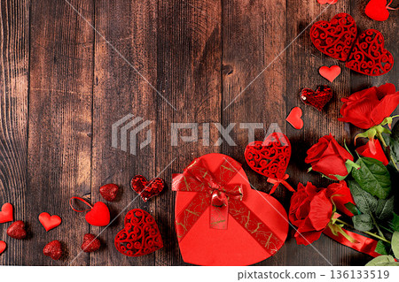 Concept for Valentine's Day or Women's Day, Mother's Day, banner. Greeting card, roses, hearts and gift boxes on a wooden background, happy holiday, birthday greetings, selective focus 136133519