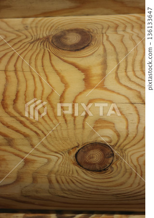 Fragment of a log cabin. Longitudinal seam between logs. View from inside the room. Close-up. 136133647