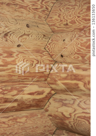 Fragment of a log cabin. Corner joint of the logs. View from inside the room. Fragment of a log cabin. Corner joint of the logs. View from inside the room. 136133650